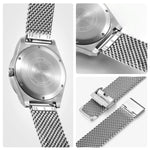 This image showcases various angles of a BERNY watch, focusing on the stainless steel back, mesh band, and clasp, emphasizing its craftsmanship and attention to detail.